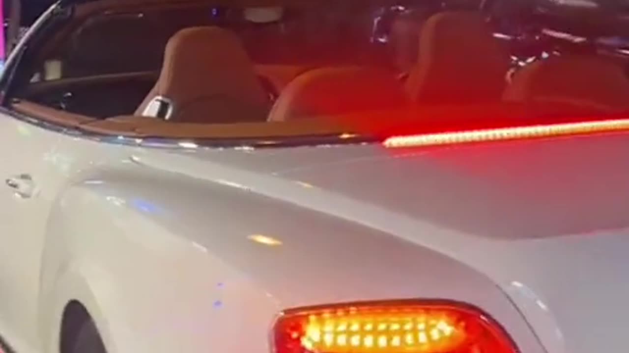 Woman Arrested After Viral Video of Lion Riding in Bentley Convertible