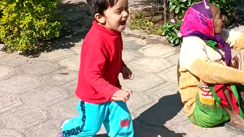 A boy playing cricket with his brother