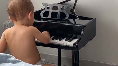 Baby Pianist Takes a Tumble