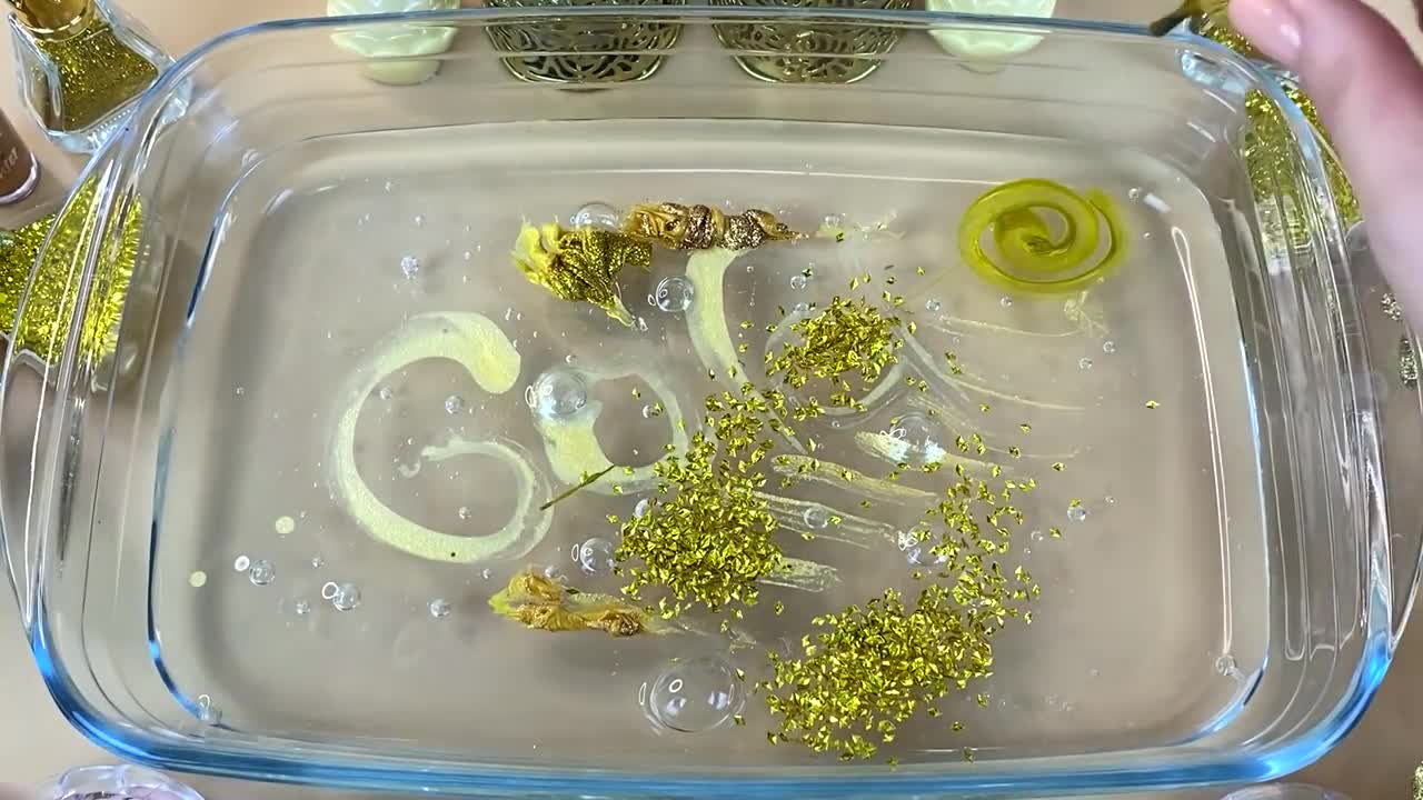 GOLD SLIME | Mixing makeup and glitter into Clear Slime | Satisfying Slime Videos