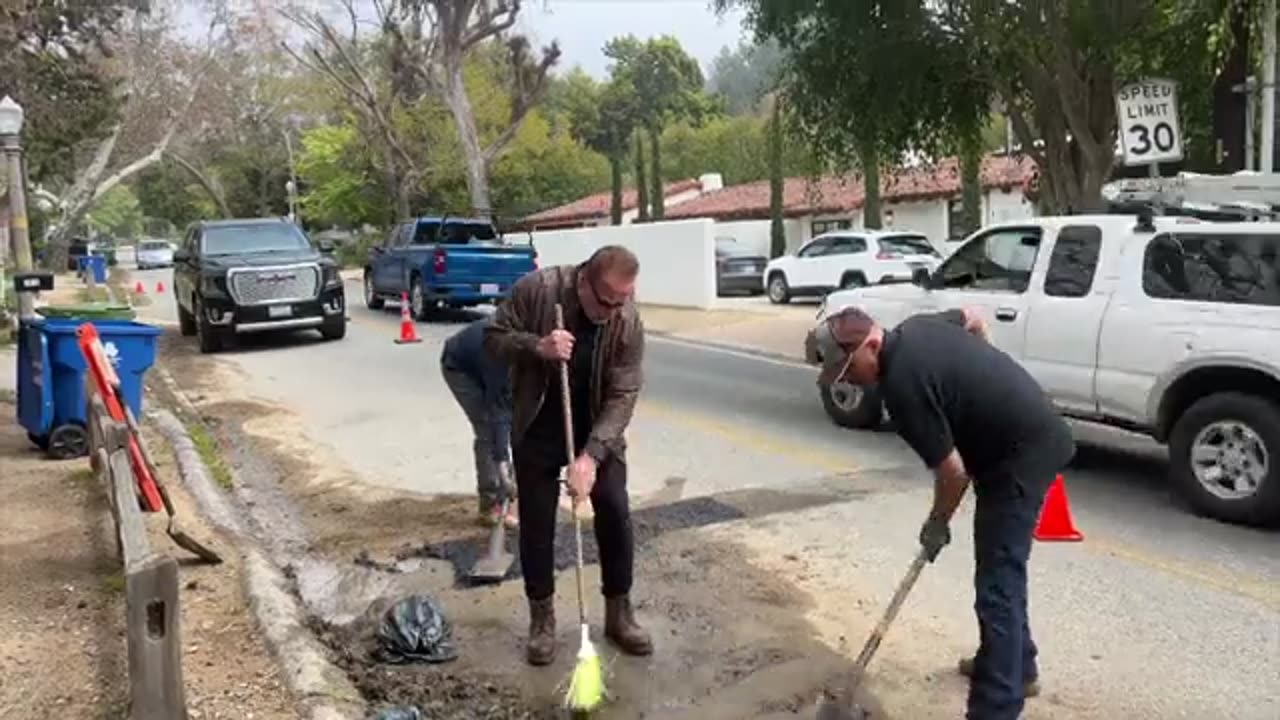 Arnold filling potholes