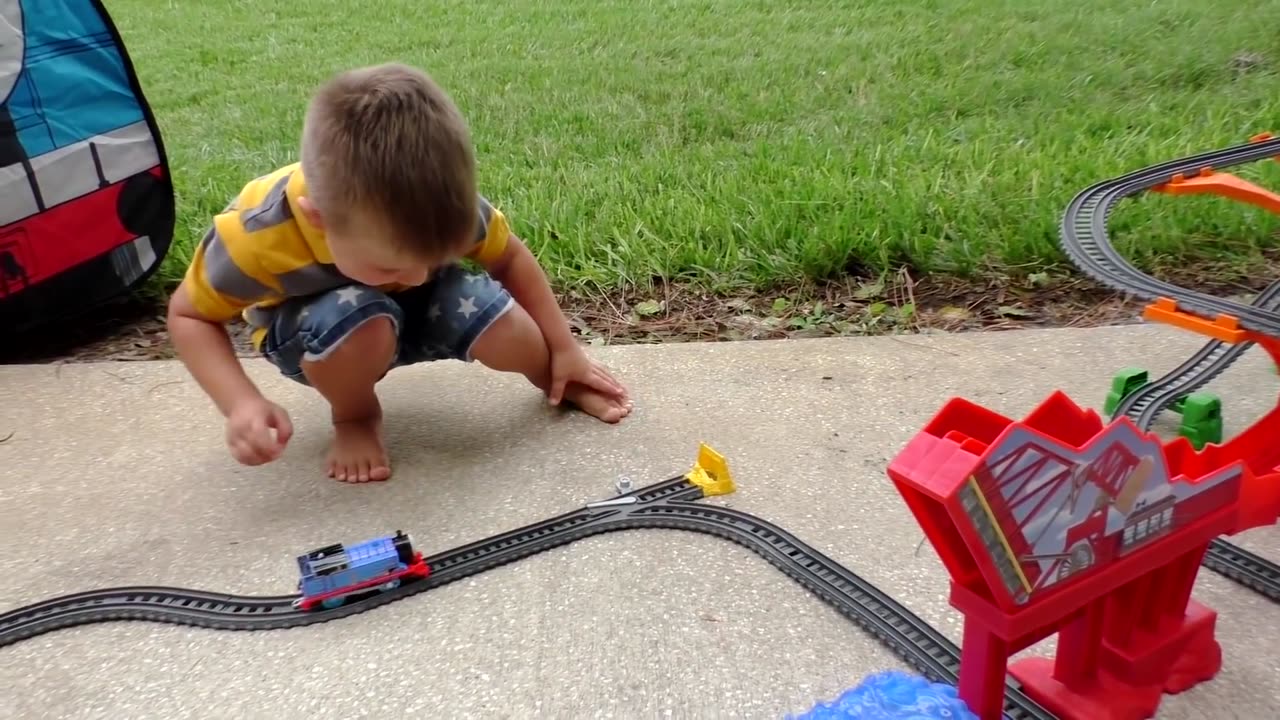 Roma and Daddy plays with toy train