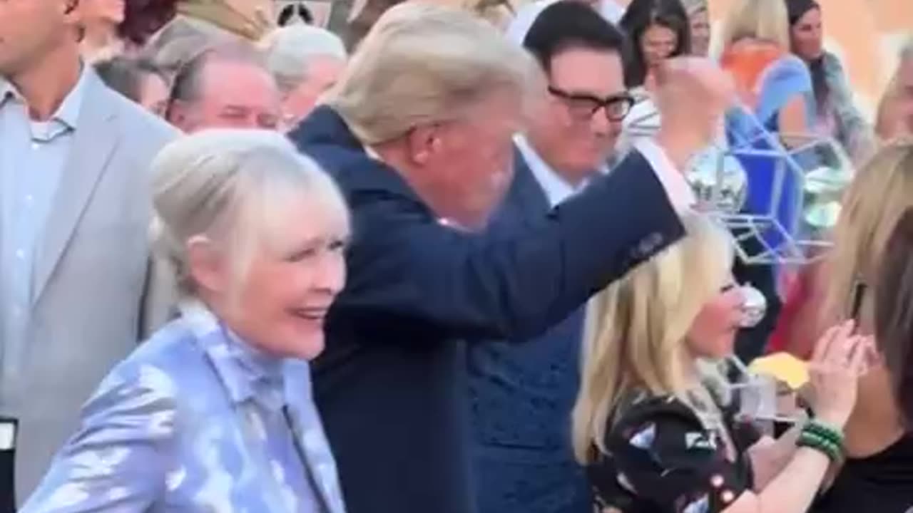 Trump watches as a Village People band rocks out at Mar-a-Lago