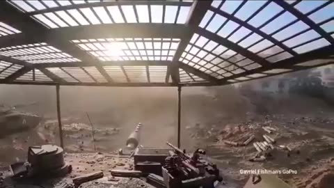 A Merkava fights in Gaza under RPG fire.