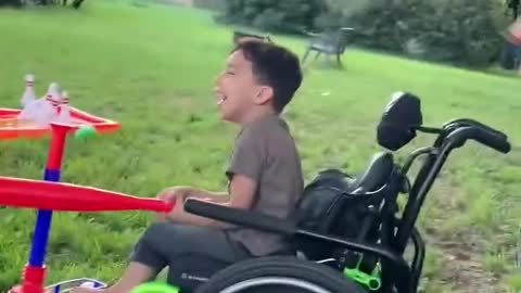 Kid in Wheelchair Gives Priceless Reaction After Playfully Hitting Baseball Shots