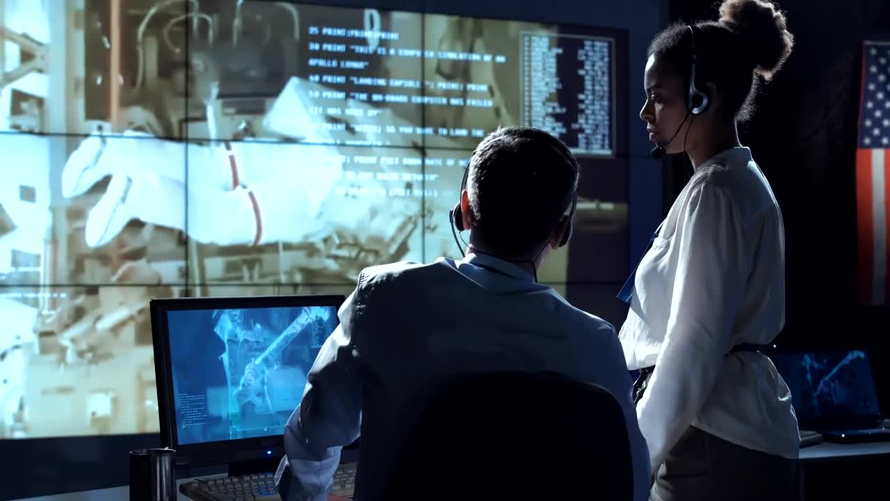Scientists in a space flight control center