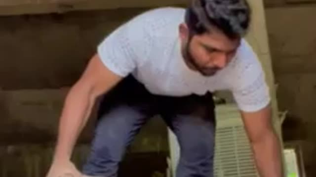 Man Does Push-Ups While Balancing on Five Bricks