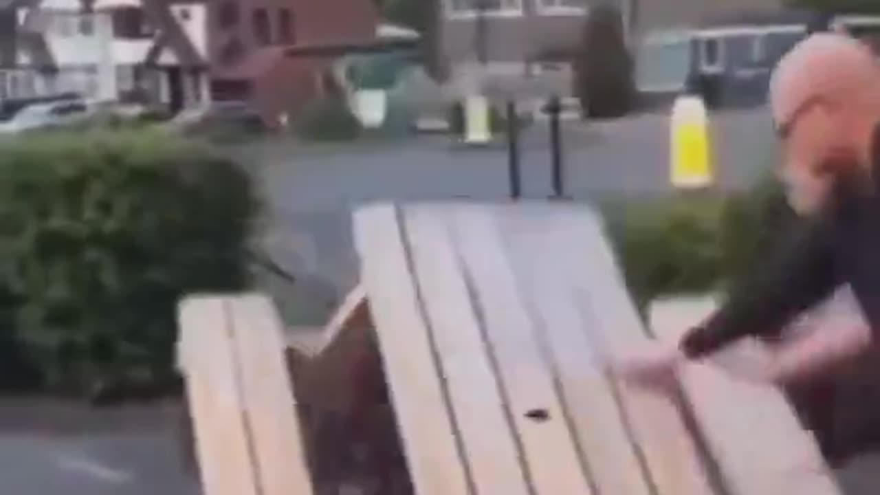 Man Attempts To Flip Table