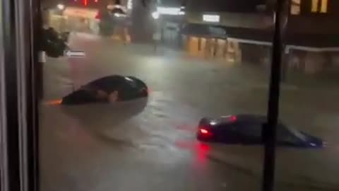 People Stuck In Bar Witness Cars Stranded In Middle Of Flooded Streets During Heavy Rain