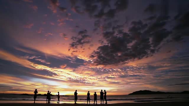 Watching the sunset at the seaside with loved ones