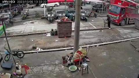 Truck falls through road