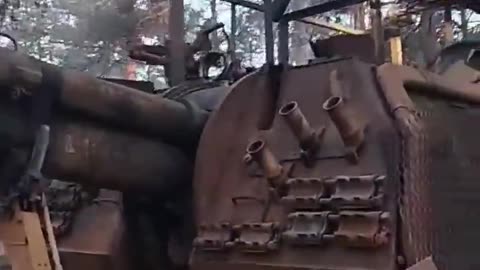 Russian soldiers checking out their 2S19M2 Msta-S after being destroyed by a baba yaga drone