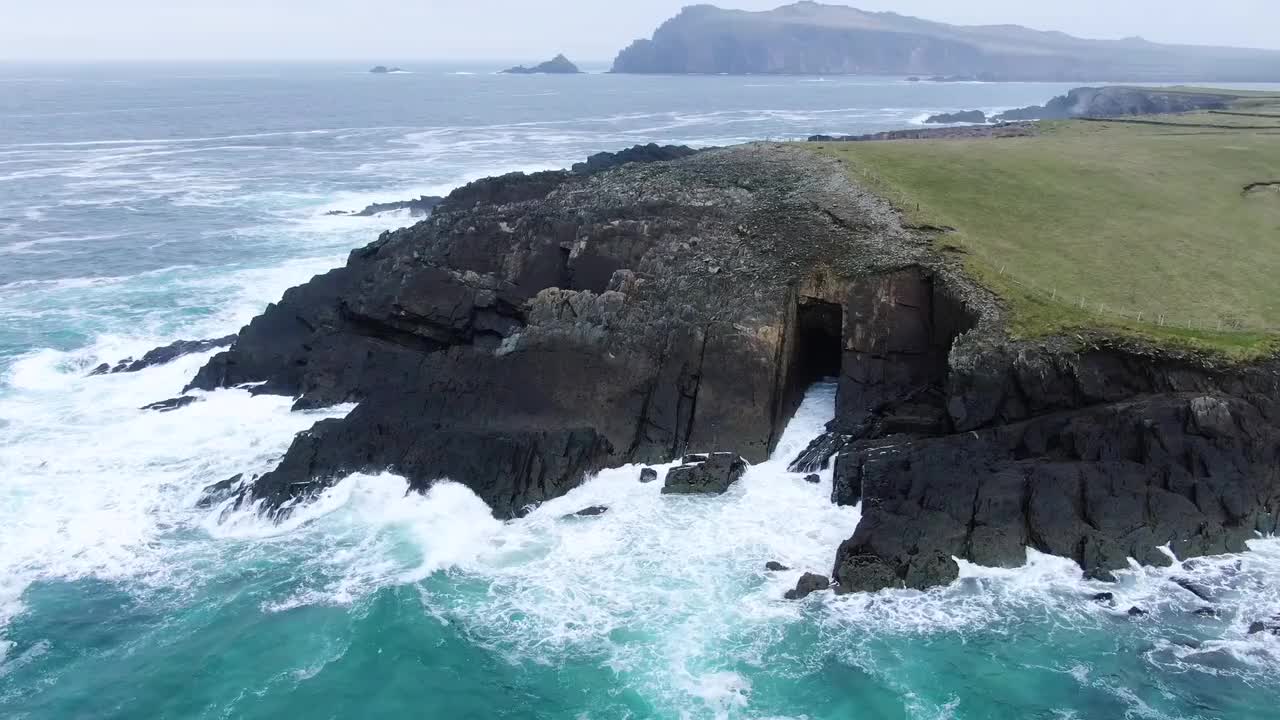 Sea Waves Crashing Against Rocky Cliffs Of Mountain