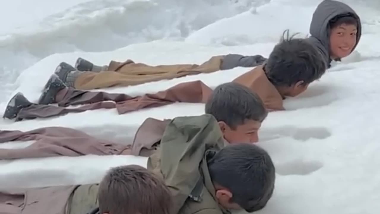 Boys play in snow ice