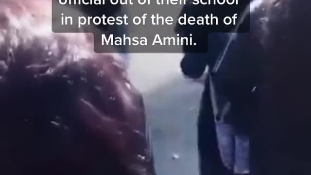 Watch the moment Iranian school girls remove their hijabs and chase a government official
