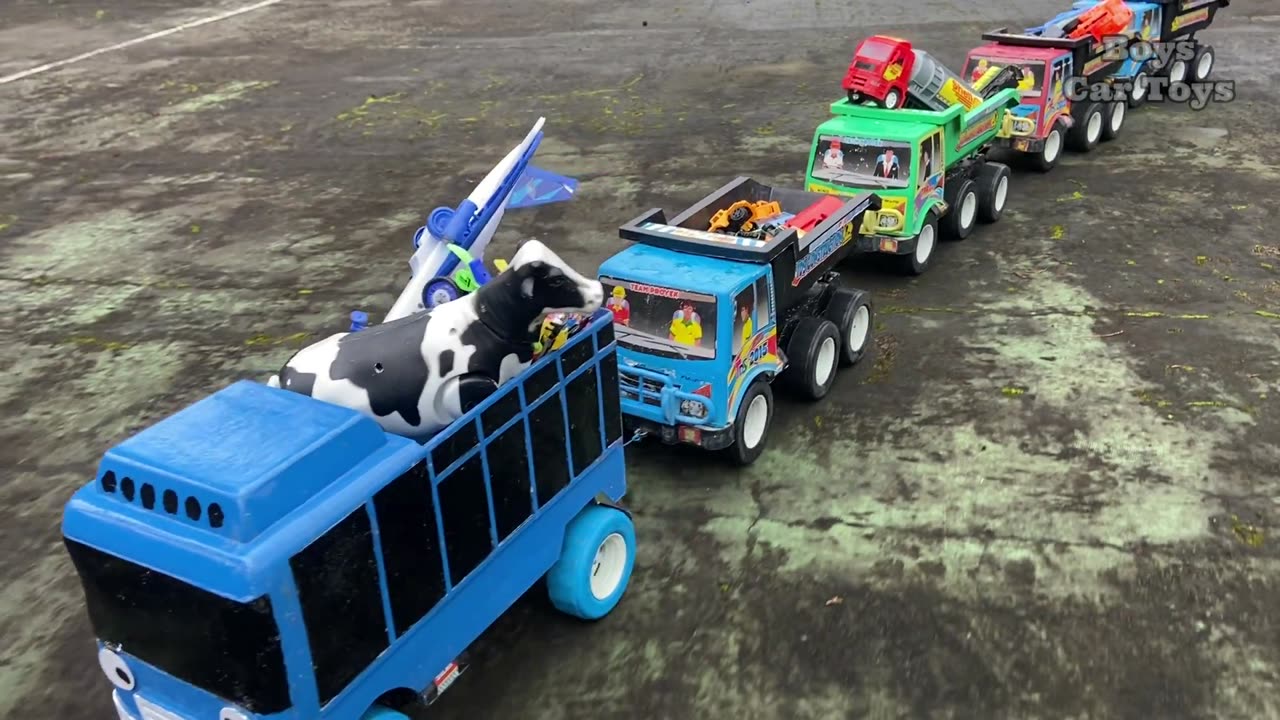 Trucks are neatly lined up looking for toys in the middle of a dense forest