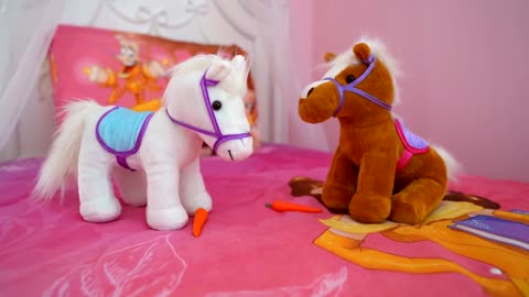 Diana and Roma Plays with toy horses