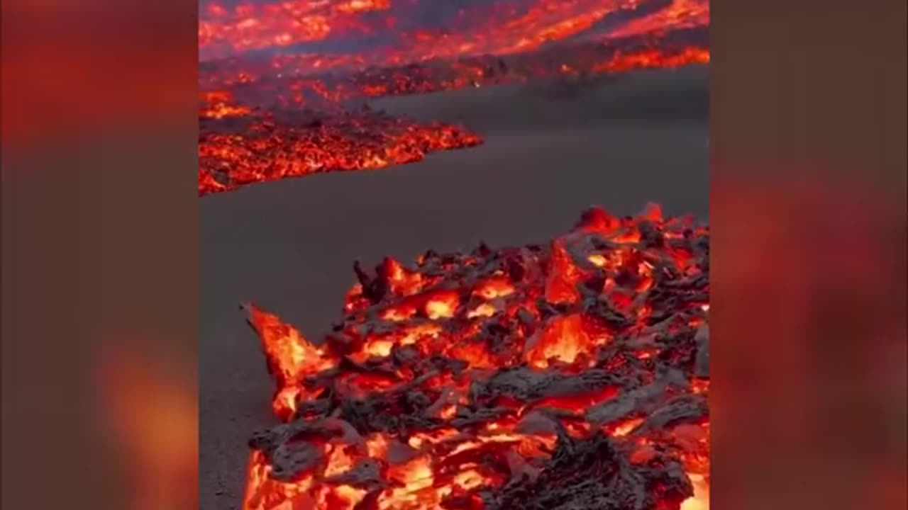 Awe-inspiring footage showing lava flowing on the Spanish island of La Palma.