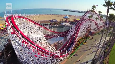 Riders climb down iconic roller coaster after mid-ride emergency