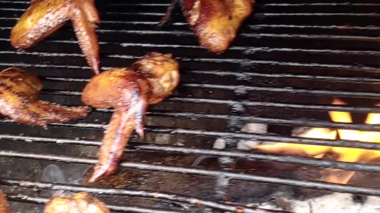 Chicken wings sizzling sound cooked with wood