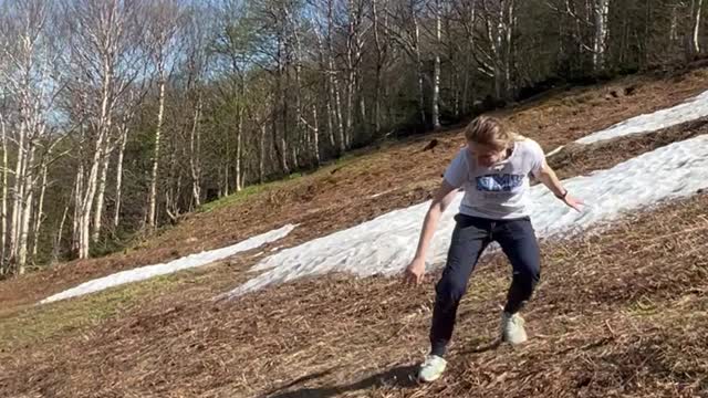 Kid Trips and Tumbles Down Hill