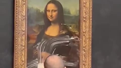 A man disguised as a woman in a wheelchair threw cake at the Mona Lisa