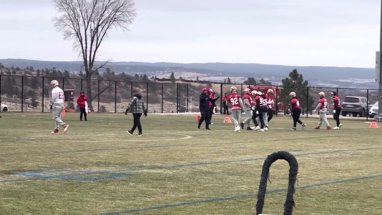 The 49ers Warm Up in the Snow at the United States Air Force Academy