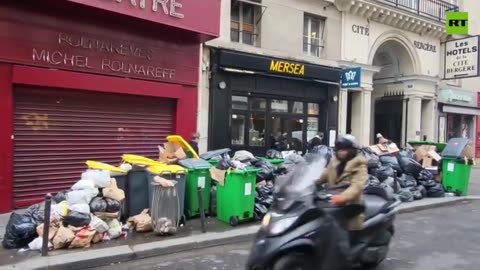 Paris streets flooded with rubbish as cleaning workers strike