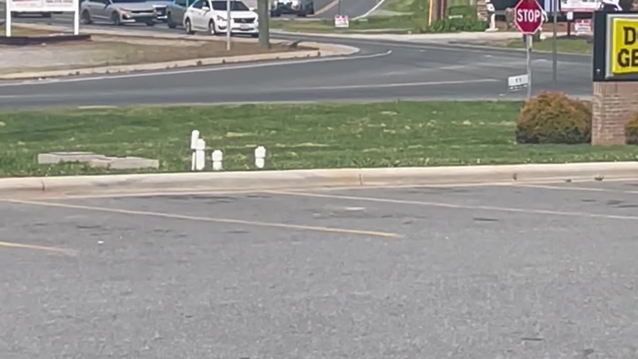 Police Chase Car Near Store Parking Lot