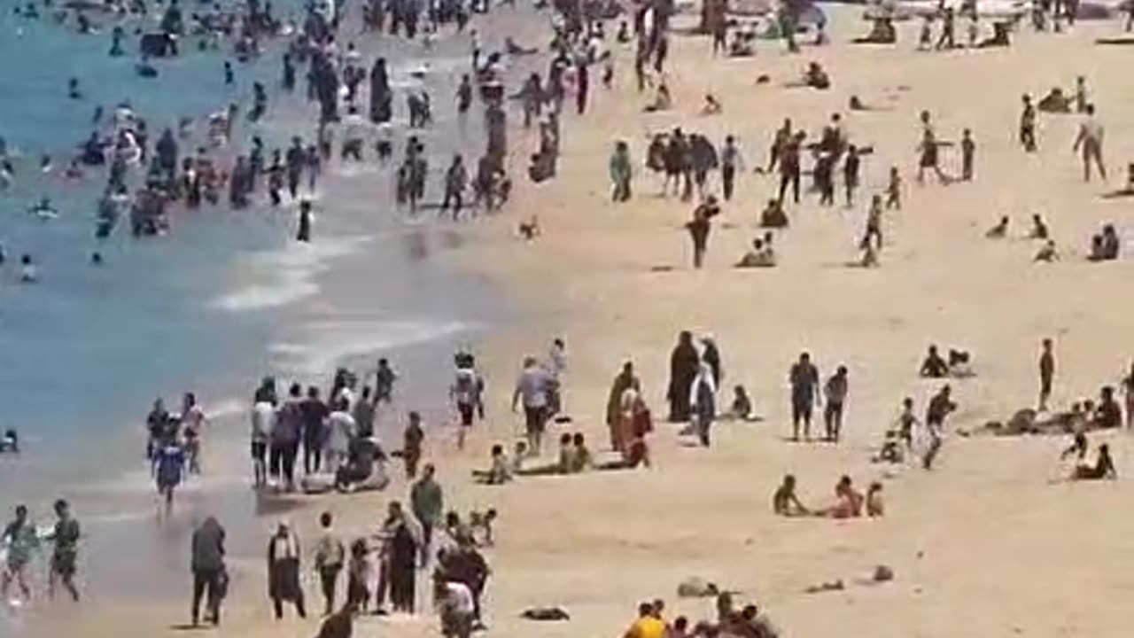 "Thousands of Palestinians on the beach of Deir al-Balah in the central Gaza Strip."