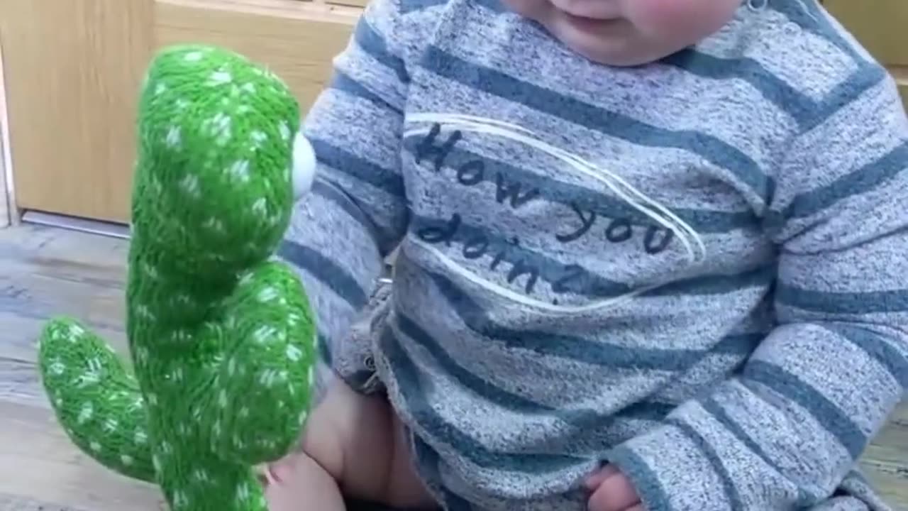 Cute Babies Playing with Dancing CactusHilarious shorts shortvideo funnybaby