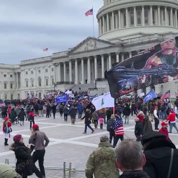 Ken Harrelson films the crowd slow walking to the East Steps