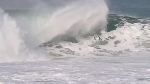 Man practices surfing the waves