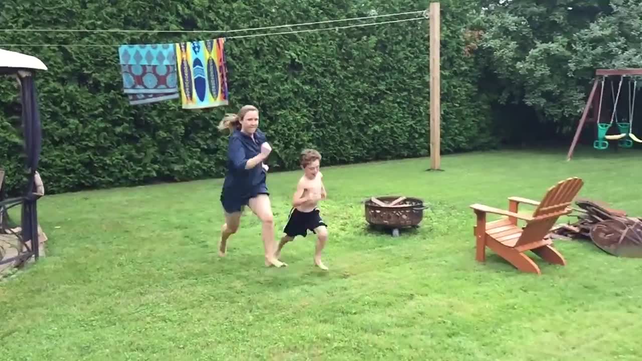 Mom bails into bushes after accepting race challenge from son