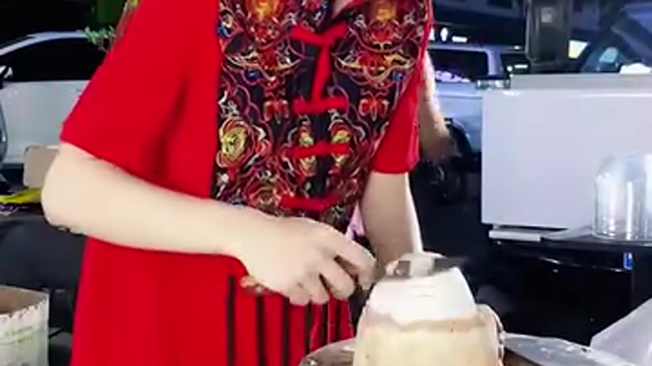 Cutting a coconut!
