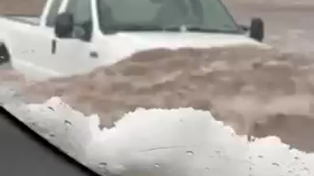 Truck Driver Fearlessly Drives Through Flooded Street