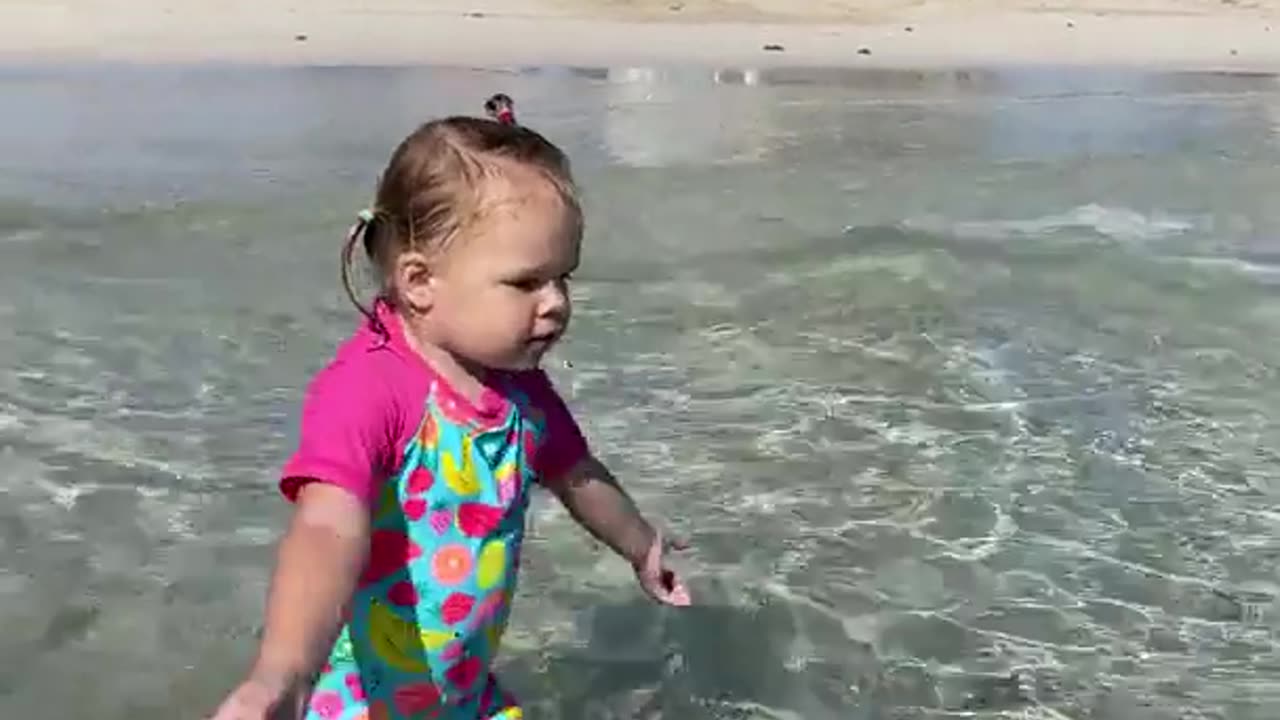 Funny Naomi is walking in the ocean, funny baby video