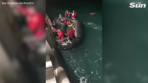 Dramatic video shows rescue migrants from sinking dinghy in the Channel