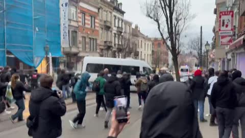 Brussels police are forced to flee in their vehicles