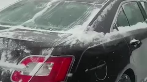 Dad Uses Son to Clean Snow Off Car