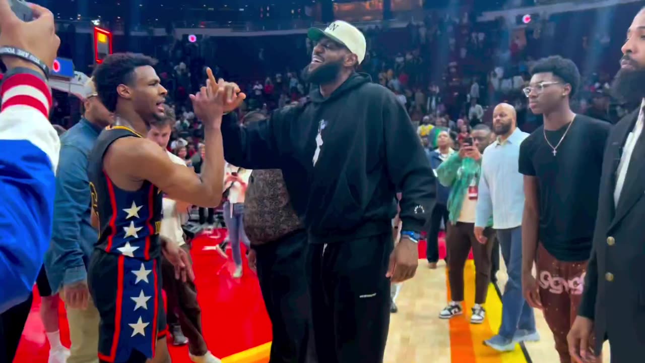 LeBron James and son bronny handshake after McDonald’s all American game