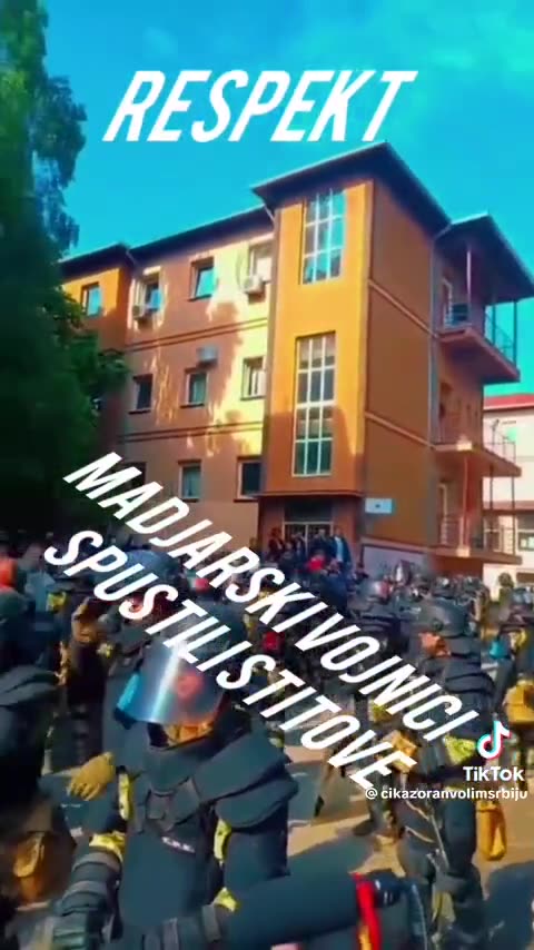 Hungarian KFOR members lower their shields 🛡, applauded by local Serbs