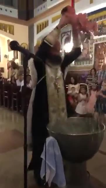 Terrorized and Screaming Baby "Baptized"....