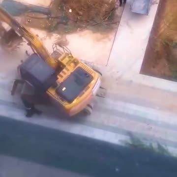 Looks like this excavator has his own plans for the day!.hd