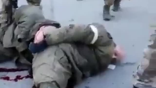 Ukraine Nazis shoot Russian POW in KNEES they bleed to death