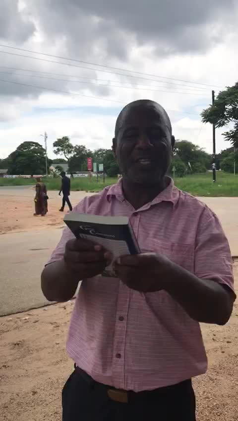 Zambian Man receiving The Great Controversy