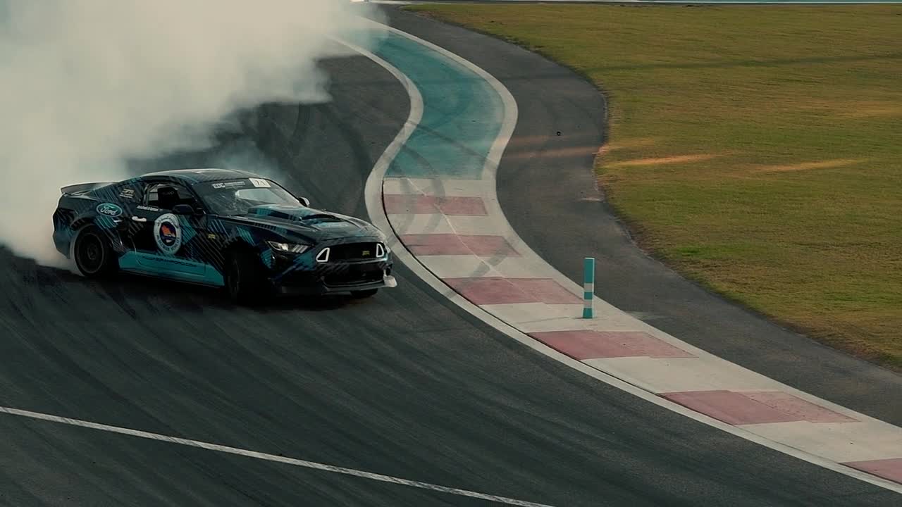 A Car Drifting in Asphalt Road