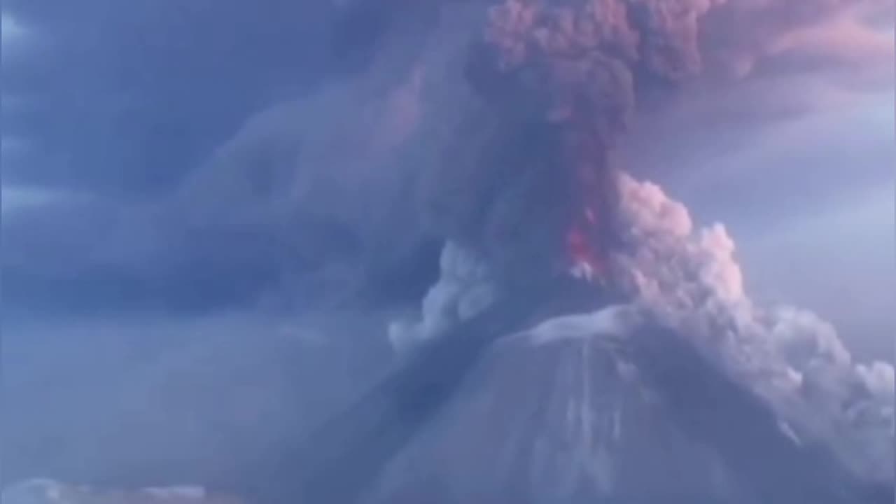 Klyuchevskaya volcano in Kamchatka Russia spewing purple ash