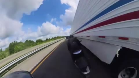 motorcyclist miraculously survives lane splitting