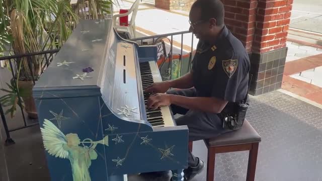 KEYS-TONE COP: Police Captain Flaunts His Piano Skills